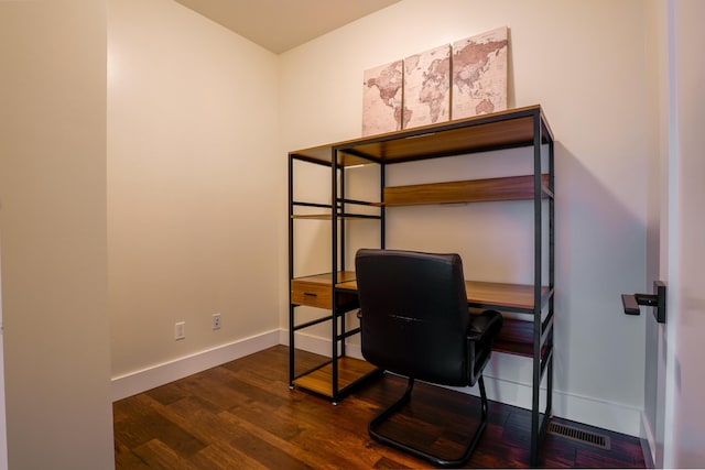 bedroom with dark wood-type flooring