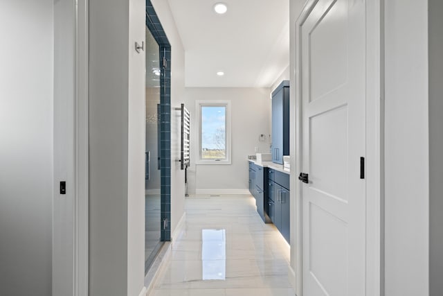 bathroom with vanity and an enclosed shower