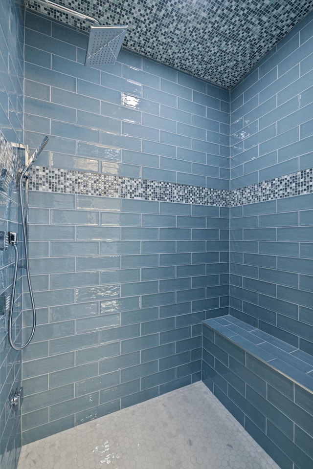 bathroom with a tile shower