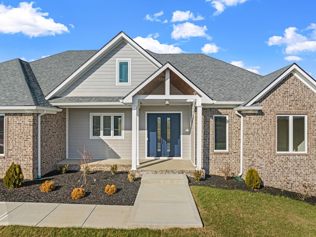 view of front of home featuring french doors and a front yard