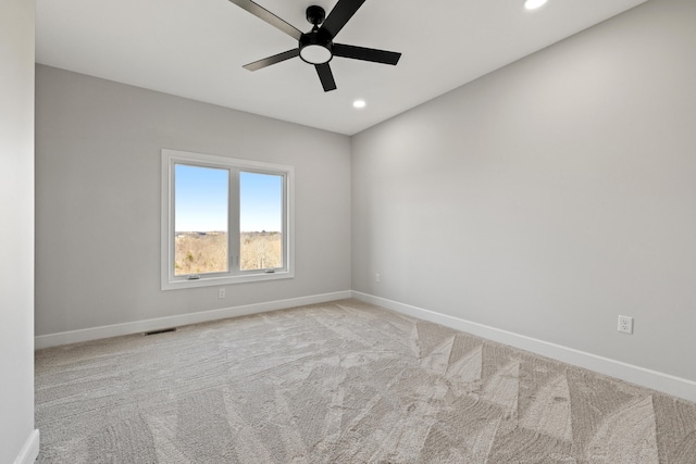 carpeted empty room with ceiling fan