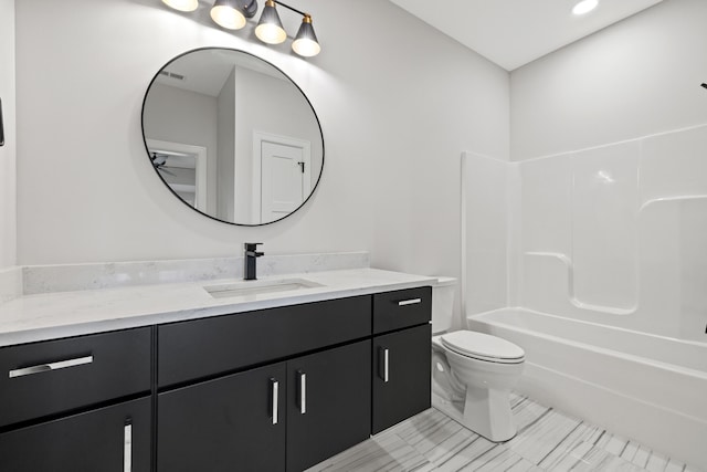 full bathroom featuring vanity, toilet, and shower / tub combination