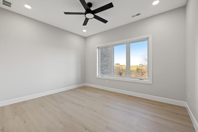 unfurnished room featuring light wood-type flooring and ceiling fan