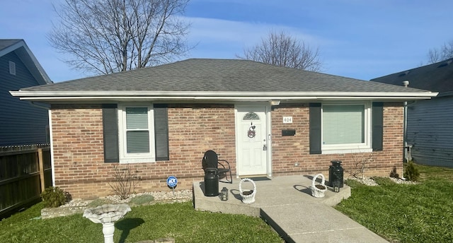 view of front of property featuring a patio area and a front lawn