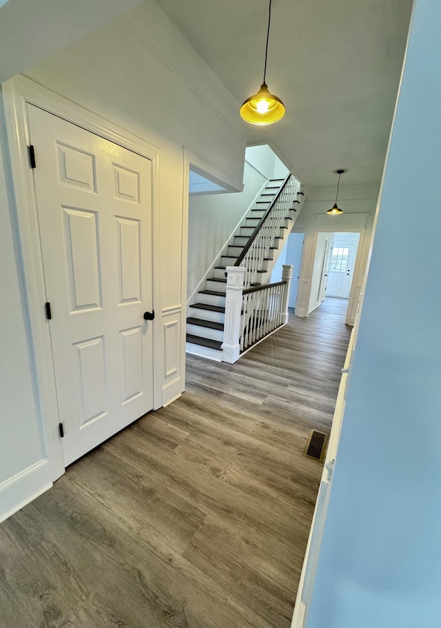 hall featuring wood-type flooring