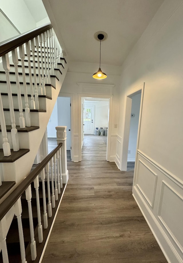 hall with dark hardwood / wood-style flooring