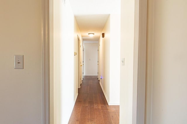 corridor featuring wood-type flooring