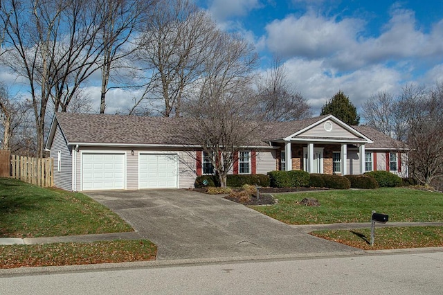 view of front of property with a front lawn and a garage