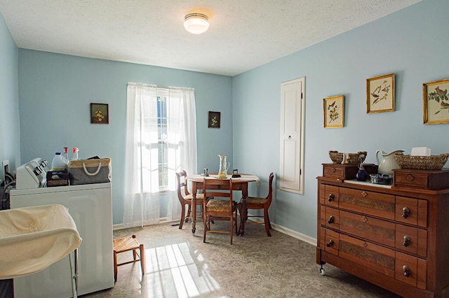 sitting room with washing machine and clothes dryer