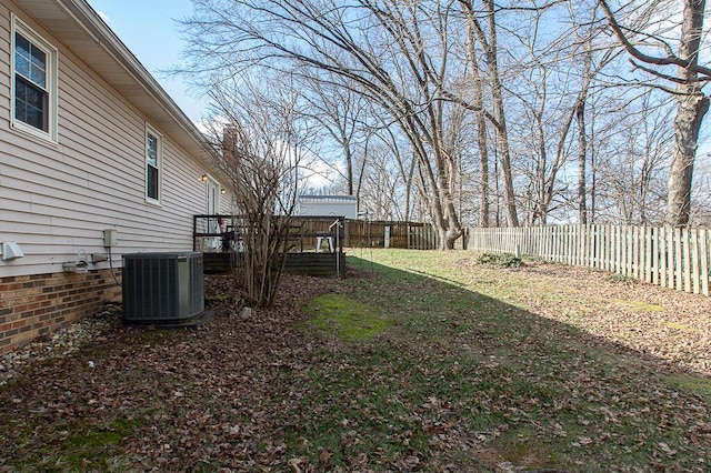 view of yard with a deck and cooling unit