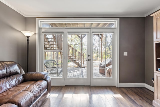 doorway with dark hardwood / wood-style floors and crown molding