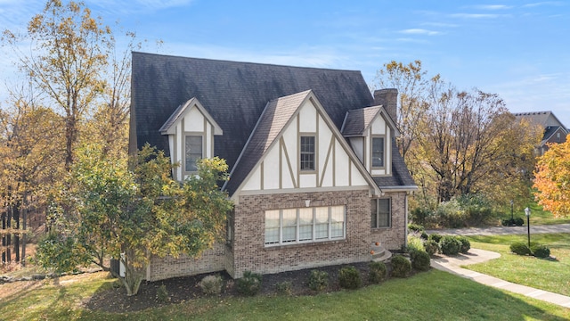 view of side of home featuring a lawn