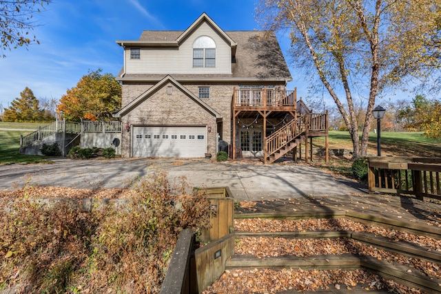 view of front of property featuring a garage and a deck