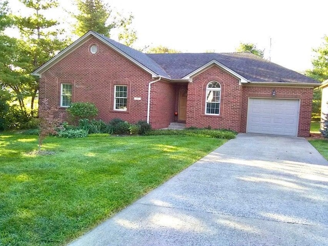 single story home with a garage and a front lawn