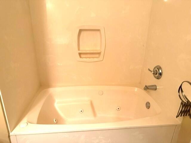 bathroom featuring a tub to relax in