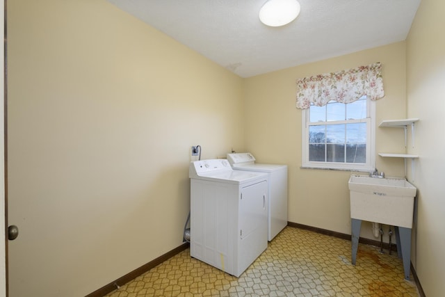 laundry area featuring separate washer and dryer and a textured ceiling