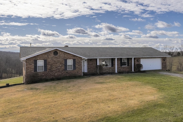 single story home with a garage and a front lawn