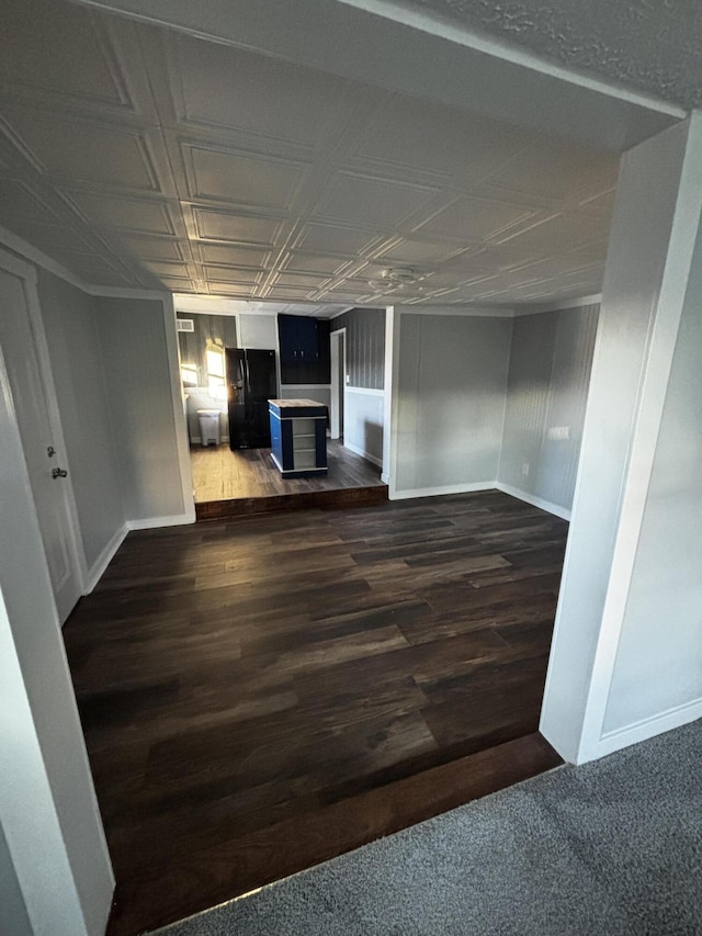 unfurnished living room featuring dark hardwood / wood-style floors