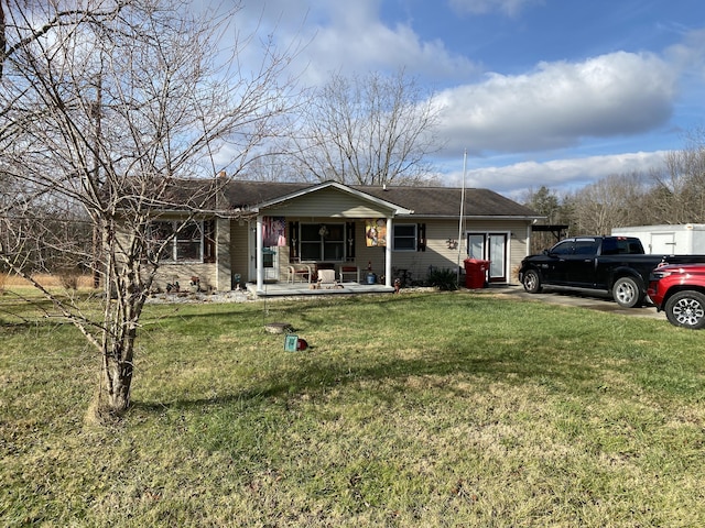 ranch-style house with covered porch and a front yard