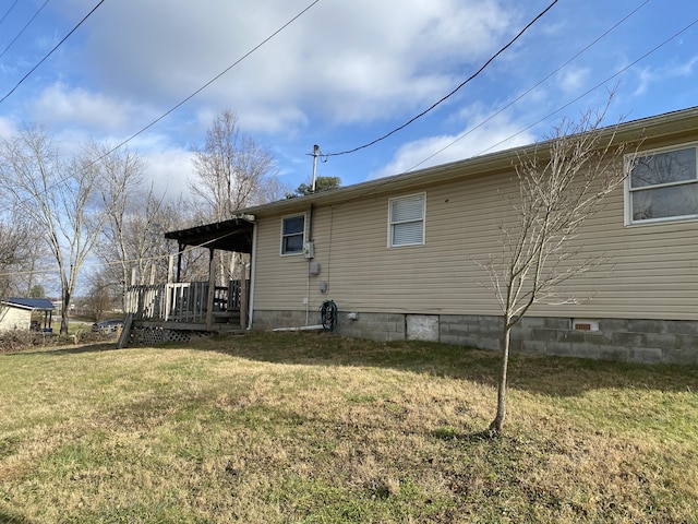 back of property featuring a lawn