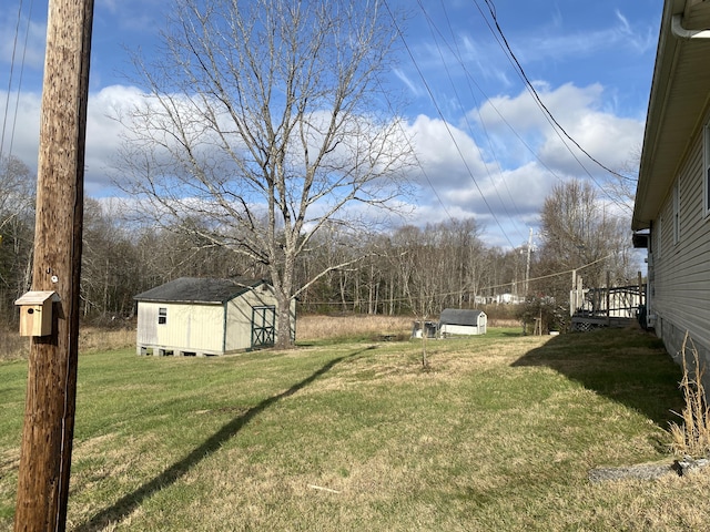 view of yard featuring a shed and a deck