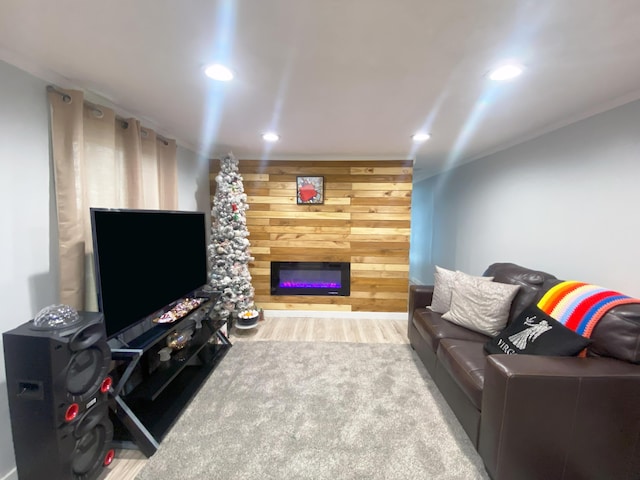 living room featuring carpet flooring and wood walls