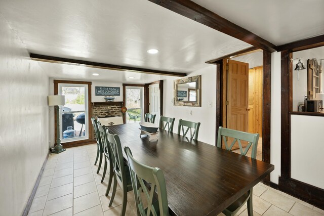 dining room with beam ceiling, a fireplace, light tile patterned floors, recessed lighting, and baseboards