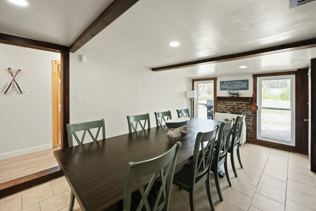 dining space with beamed ceiling, light tile patterned flooring, and recessed lighting