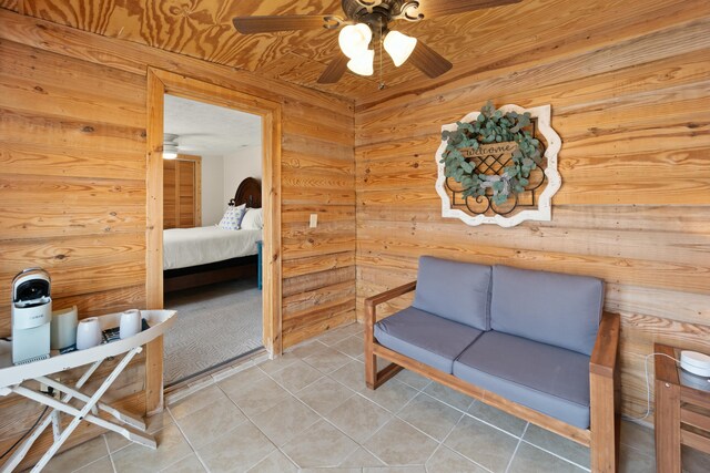 cabin featuring metal roof, faux log siding, a porch, and a yard