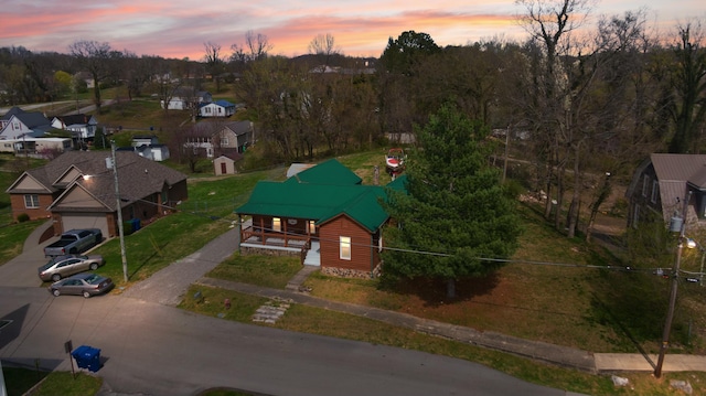 aerial view at dusk with a residential view