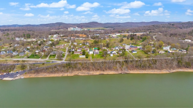 drone / aerial view with a water and mountain view