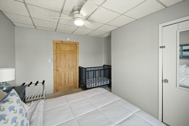 carpeted bedroom with visible vents and a ceiling fan