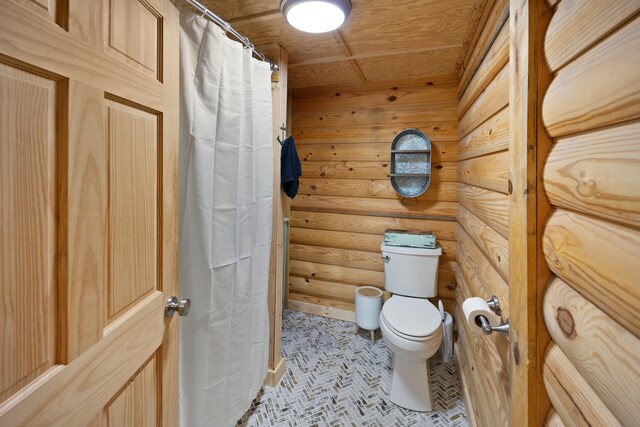 bathroom with wooden ceiling, vanity, and log walls