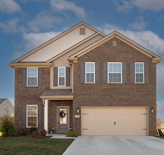 view of front of house featuring a front yard and a garage