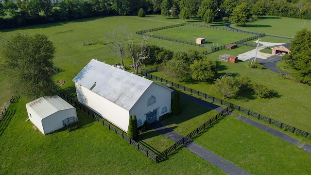 birds eye view of property featuring a rural view