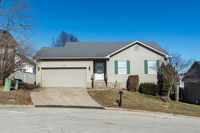 ranch-style house featuring a garage