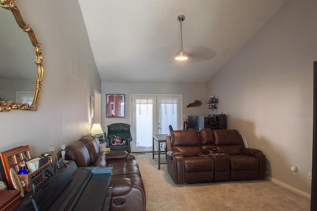 living room featuring light carpet, french doors, and vaulted ceiling