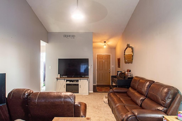 living room with carpet and lofted ceiling