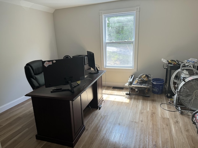 office featuring light hardwood / wood-style flooring and lofted ceiling