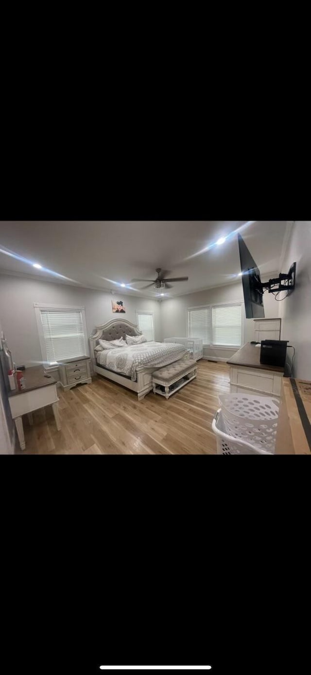 unfurnished bedroom featuring ceiling fan and light hardwood / wood-style floors