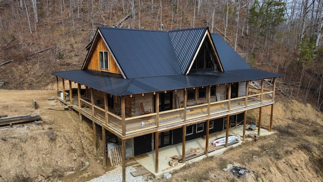 rear view of house with metal roof