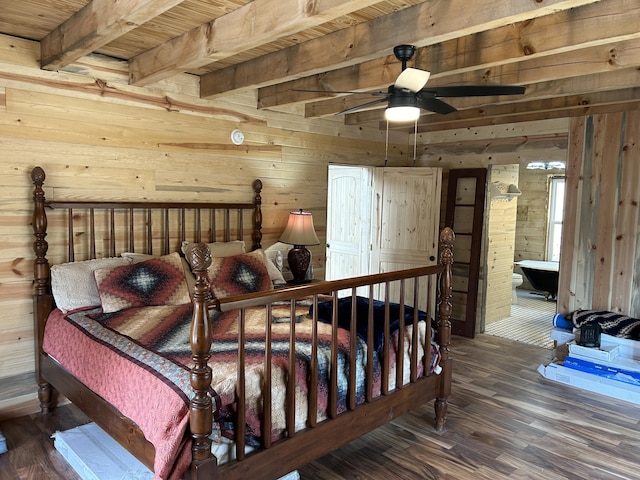 bedroom featuring wooden ceiling, wooden walls, beam ceiling, and wood finished floors