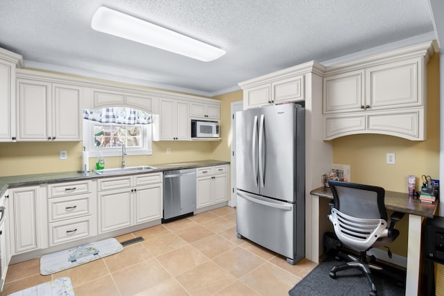 kitchen featuring a sink, stainless steel appliances, visible vents, and light tile patterned floors