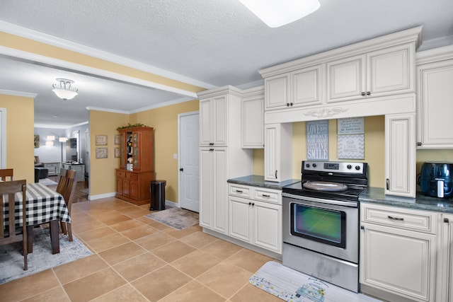 kitchen featuring light tile patterned floors, stainless steel electric stove, dark countertops, and crown molding