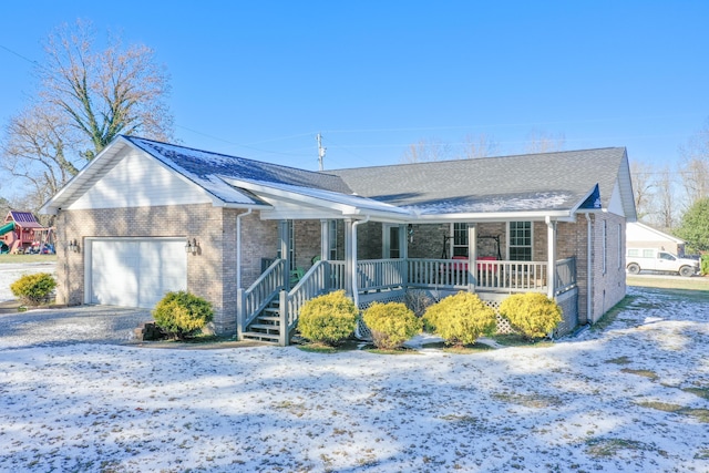 single story home with a garage and a porch