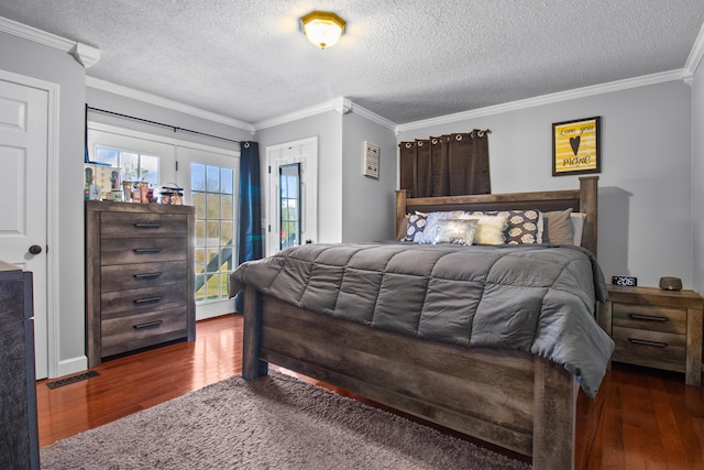 bedroom featuring wood finished floors, crown molding, and access to outside