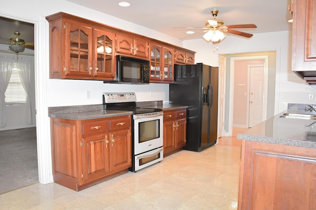 781 E Lexington St, Harrodsburg, KY 40330 - kitchen with black appliances, ceiling fan, glass insert cabinets, brown cabinetry, and a sink
