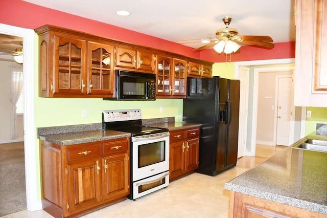 kitchen with ceiling fan and black appliances