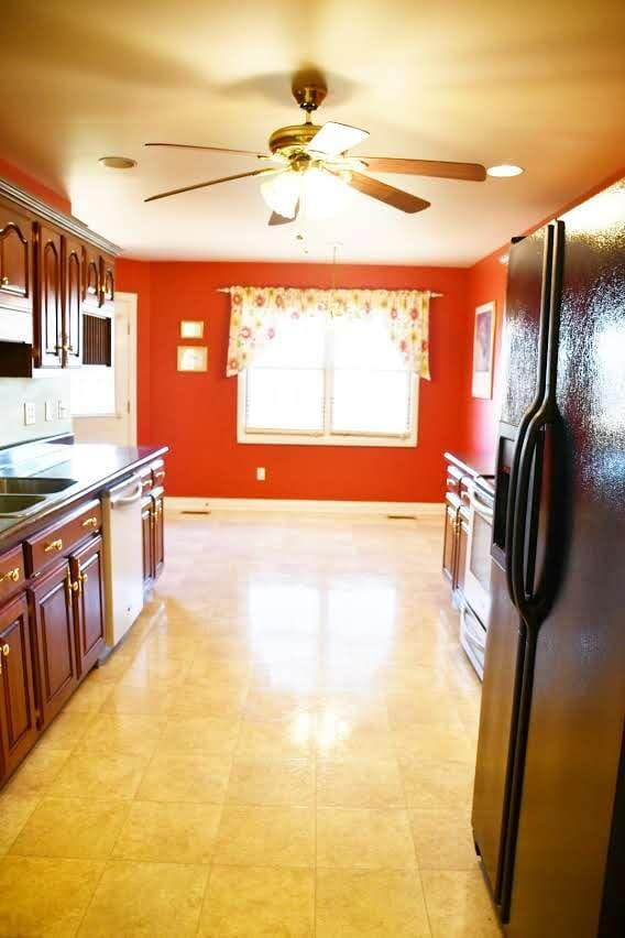 kitchen with ceiling fan, sink, and white appliances