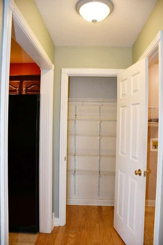 hallway with light hardwood / wood-style flooring